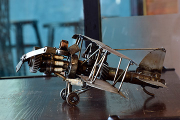 The plane is a toy made of steel and various equipment. Assembled together