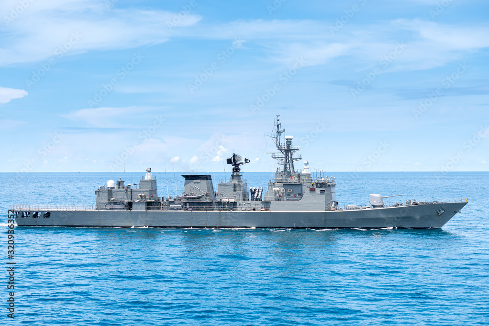 Wall mural guided missile frigate type navy ship sails in the sea to protect sea line of communcation or sloc