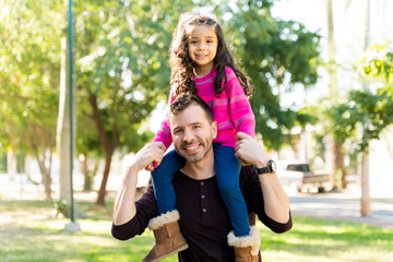 Happy Father And Daughter Enjoying At Park