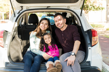 Happy Family In Vehicle During Picnic