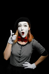 Female mime points a finger at you. Vertical waist up portrait of actress