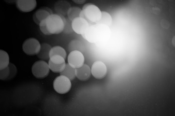 Abstract white bokeh on a black background 