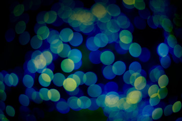 Abstract white bokeh on a blue background 
