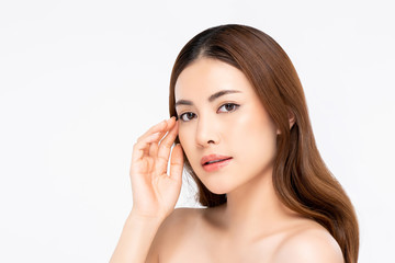 Beautiful Asian woman with fair skin touching face