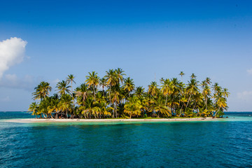 Palm fringed islands, blue water, caribbean, beach