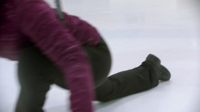 Curling training - a young woman pushes off from the stand with a stone biter