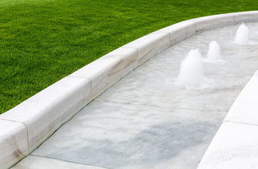 Fountain device in garden landscape  