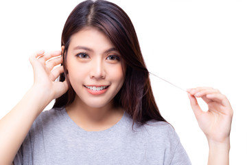 Portrait pretty asian young woman. Attractive beautiful girl get happy and relaxing with smile face. Lovely woman act like a shy someone. She grab her hair with lovely smile. isolated on white