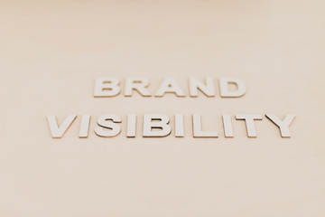 Brand Visibility message on desk with shallow depth of field and monotone editing, concept of building a successful business