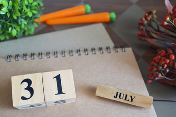 July 31, Appointment date with number cube design for background.