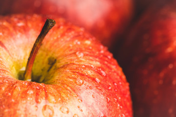 Close-up apples on the rustic wooden background. Selective focus. Shallow depth of field.