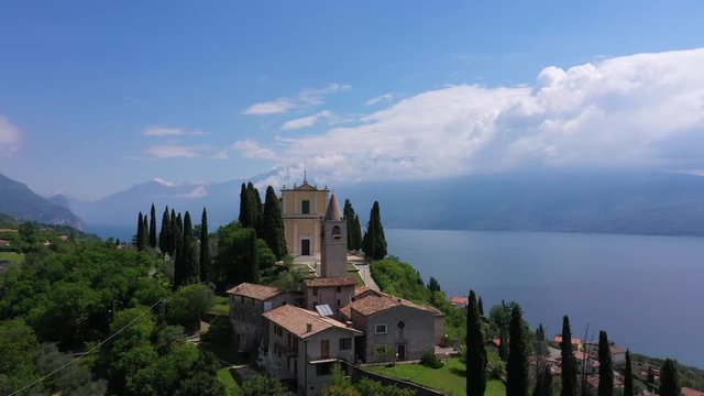 Aerial view, church Chiesa di San Michele Arcangelo, Italy. In the background Lake Garda	