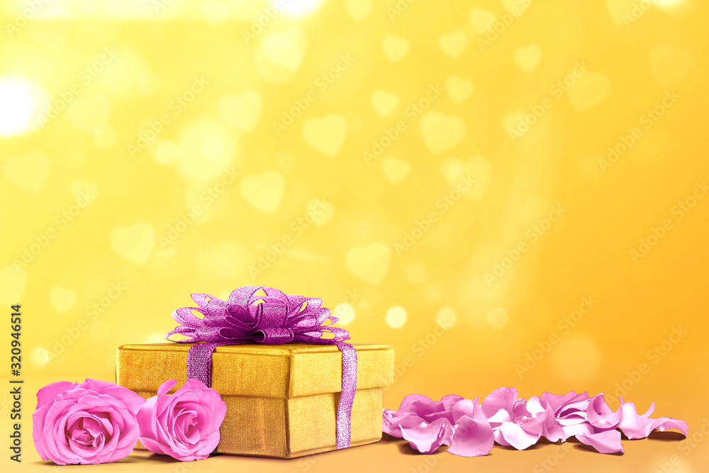 Canvas Prints Gift box and pink rose petals on a yellow background