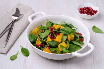 Spinach salad and baked pumpkin
