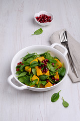 Spinach salad and baked pumpkin