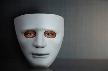 white plastic face mask with human eye