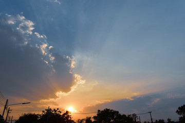 golden light rays of sunset sky background