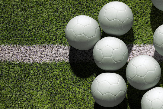 Top view white soccer ball with line on soccer field background.