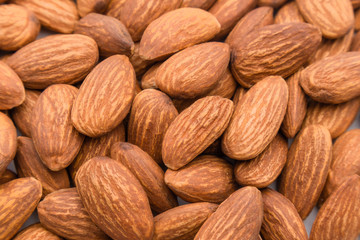 Close up peeled almond nut, almond background texture. healthy food and snack concept.