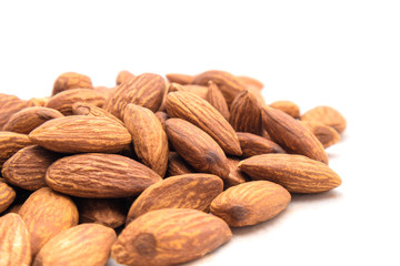 Close up group of peeled Almond nuts with white background. healthy snack