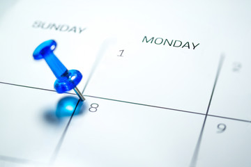 Blue push pin on 8th of Monday