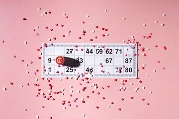 Lotto ticket with wood barrel 14 number on pink hearts background. Valentines day 14 february minimal concept.