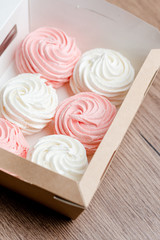 Obraz na płótnie Canvas white and pink marshmallows in a box