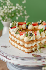 heart shaped cake with berries and flowers