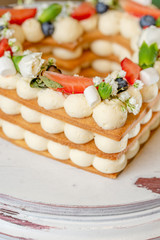 heart shaped cake with berries and flowers