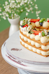 heart shaped cake with berries and flowers
