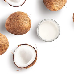 Creative layout made of coconut and coconut milk on white background. Flat lay. Food concept. Macro concept.