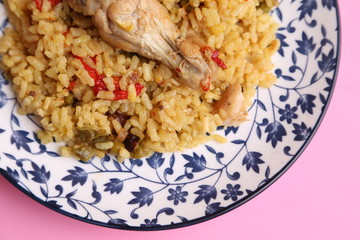 plate of rice with chicken and peppers