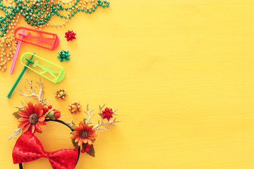 Purim celebration image (jewish carnival holiday) with noise maker toy and deer antlers floral...