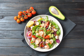 Sweet potato and carrot soup served with sour cream in wooden bowl. Orange vegetable soup concept. Vegan food