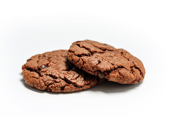 Two pieces of chocolate chip cookies on a white background.