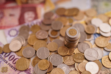 Forint Coins Hungarian currency. In the background banknotes of different denominations. Európe Hungary