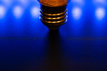 Light bulb on black background close up