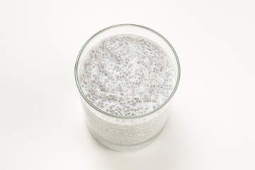Chia pudding  in glass on a white background. Space for text or design.