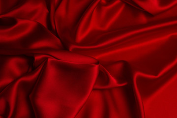 Red silk or satin luxury fabric texture can use as abstract background.
