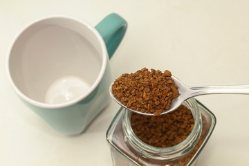 Instant coffee on spoon