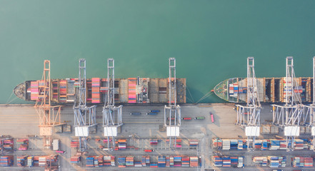 Fototapeta na wymiar Aerial view container ship to sea port loading container for import export or transportation. shipping business logistic. Trade Port and Shipping cargo to harbor, International transportation.