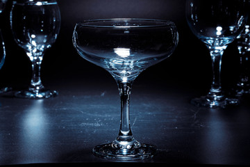 Empty  glasses for drinks on dark background
