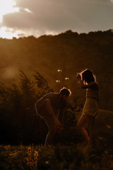 Two athletic young dancers making a performance on a mountain