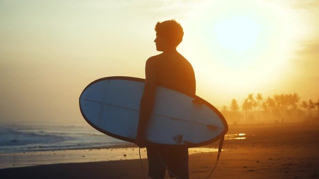 SLOW MOTION Adventure travel surfing tropical paradise young man enjoying life