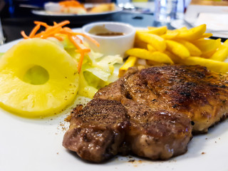 Steak on a white plate