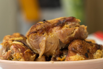 pieces of appetizing fried chicken close-up with a crispy crust lie on a plate