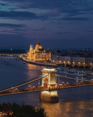 Fototapeta na wymiar Europe, Hungary, Budapest blue hour with chain bridge and Hungarian Parliament, boat cruise, sightseeing, Budapest Parlament, Vitor Orban, Fidesz. Politics. Hungary