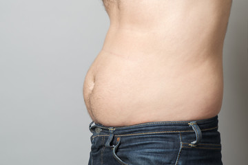 Man showing his fat on the stomach