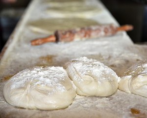 preparing dough balls for baking