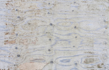 Old cracked plywood with a beautiful texture. Frame with an unusual background and free space for ad, advertisement.